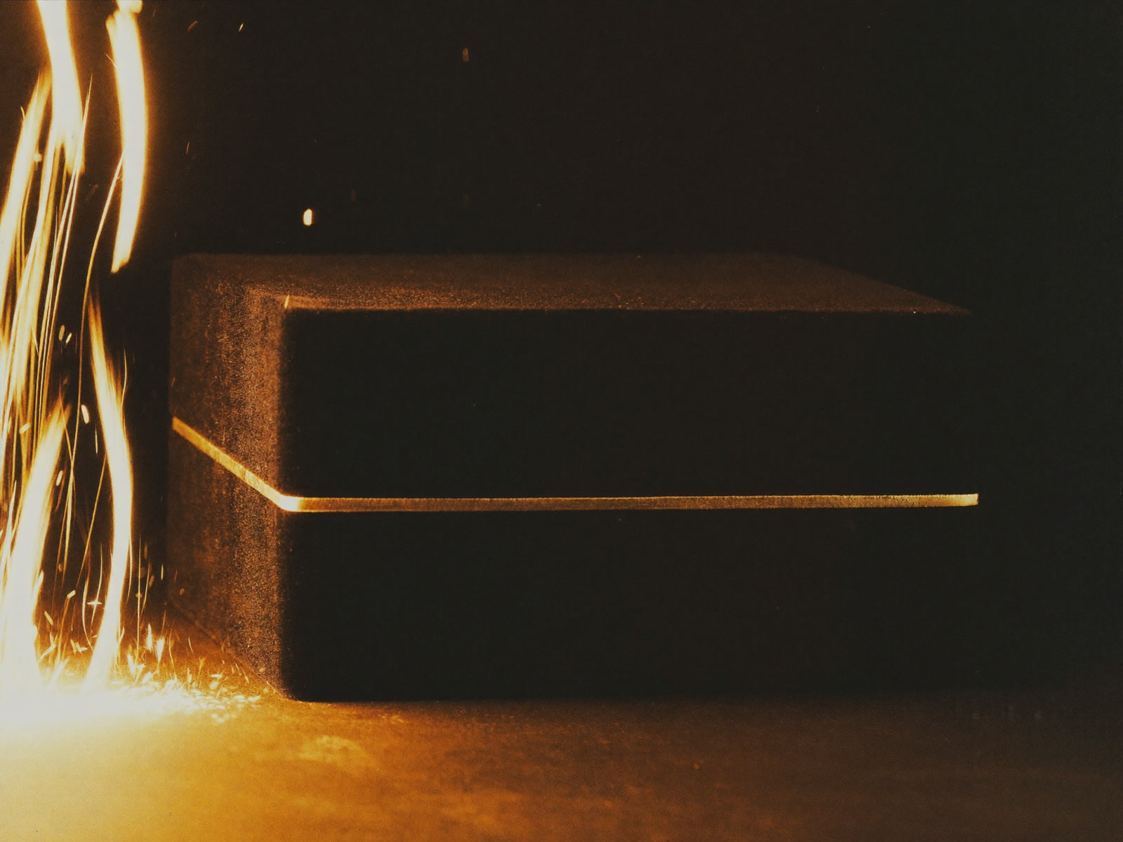 The Jarquín jewelry box resting on dark velvet in warm gold light